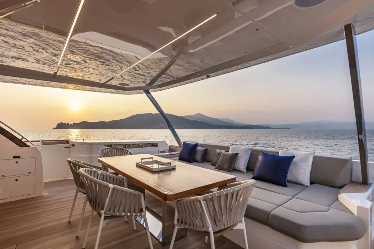 Ferretti 920, flybridge — Luxury Yachts St. Tropez, Saint-Tropez. Gulf anchorage mornings, Pampelonne tender runs by afternoon