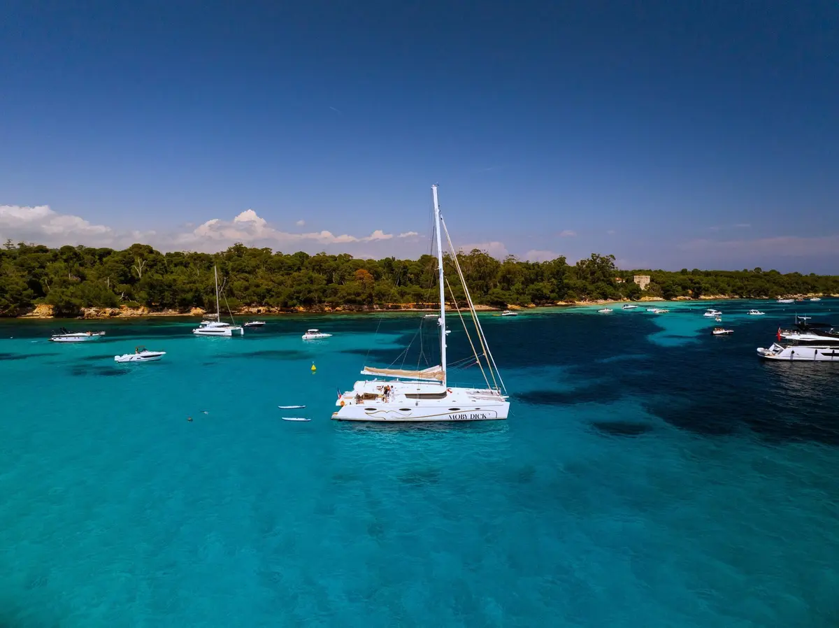 Moby-Dick, exterior — Luxury Yachts St. Tropez, Saint-Tropez. Wide catamaran calm for Cap Taillat picnic anchorages